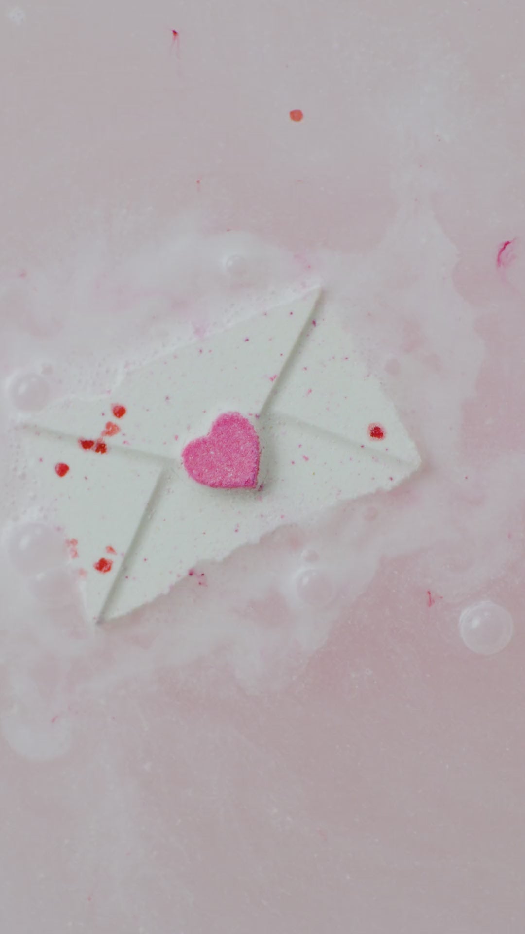 White bath bomb in the bath